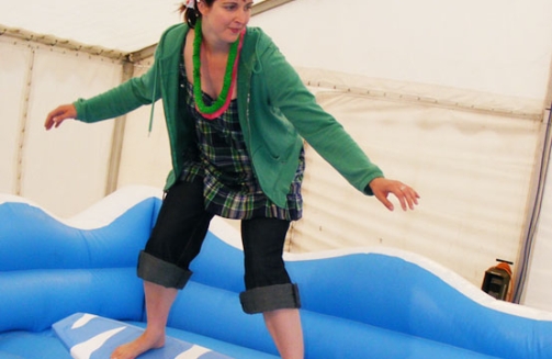 Lady on surf simulator'